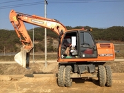 Экскаватор колесный Doosan dx140w 2010г