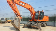 Экскаватор колесный Doosan dx210w 2012г