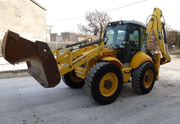 New Holland LB115B-экскаватор-погрузчик